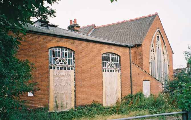 Ipswich Historic Churches Trust strikes again. Boarded up St Michael, its parish rooms to the left.