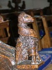 bench ends: eagle with a scroll, probably the symbol of St John