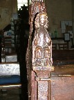 bench ends: seated figure