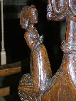 bench ends: woman in butterfly headdress